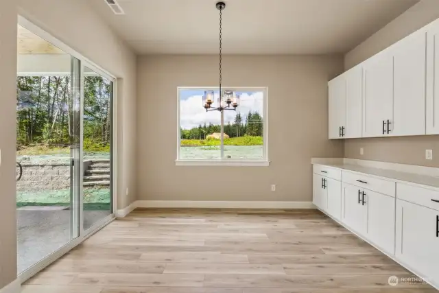 Dining area highlighted by built-ins and slider to covered pation