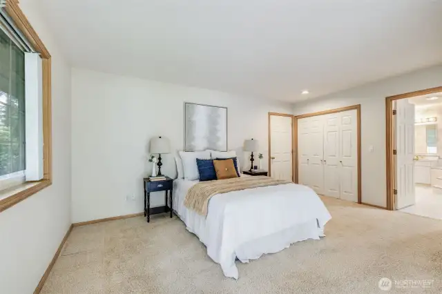 Primary bedroom with en-suite and walk-in closet.