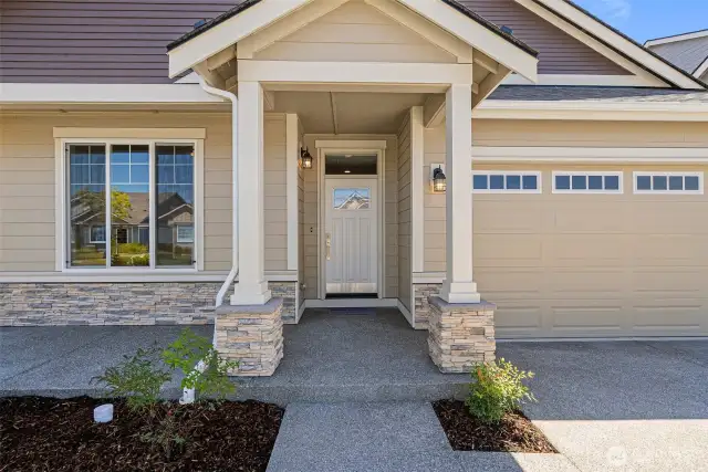 A stately front porch greets you as you enter the home.