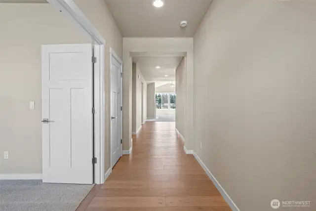 Entryway, Hardwood floors extend through hallway to Kitchen and Dining room. 3 bed/den off to the left with french doors