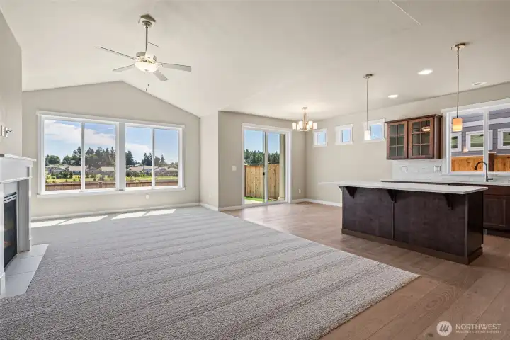 Light and bright open space, perfect for entertaining. Living room has vaulted ceilings, and ceiling fan