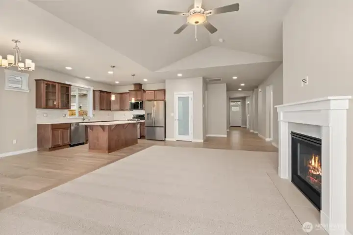 Light and bright open space, perfect for entertaining. Living room has vaulted ceilings, and ceiling fan