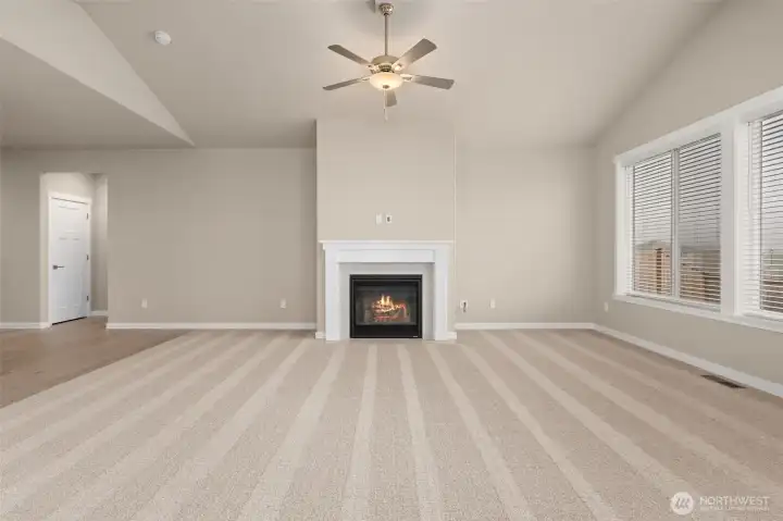 Living room with Southern exposure for great natural light and a cozy gas fireplace for those cooler nights