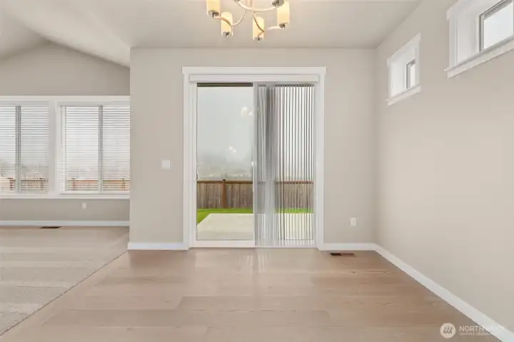 Dining room with slider door to backyard/patio area