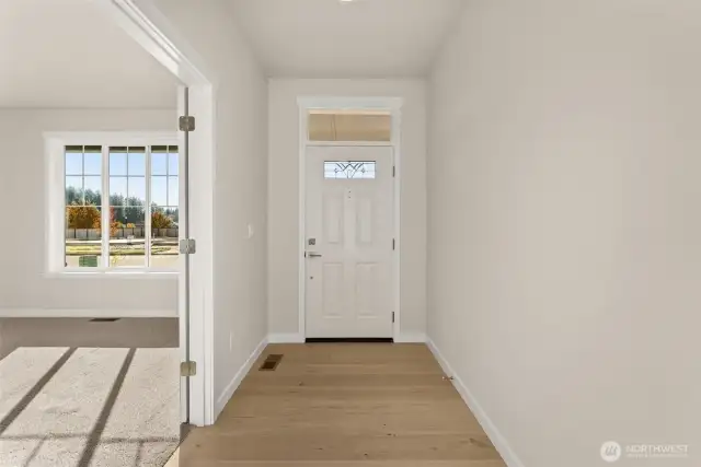 engineered hardwood floors greet you at the entry