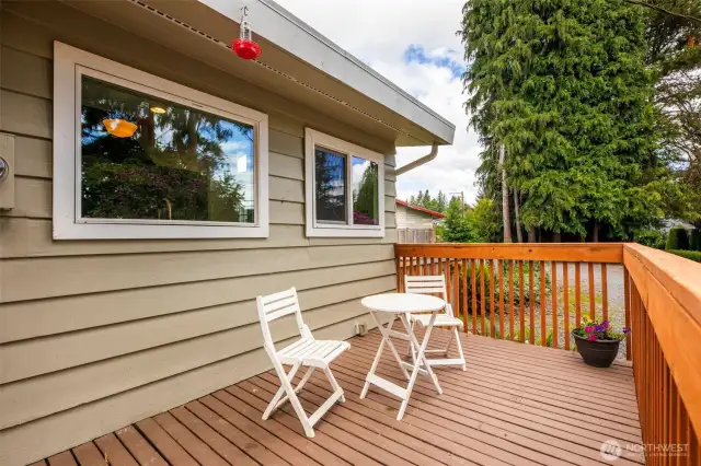 As you walk up to the home you are met with a large deck for enjoying the private front yard.