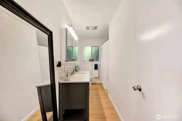 Beautiful bathroom off the hallway upstairs to service the three bedrooms upstairs.