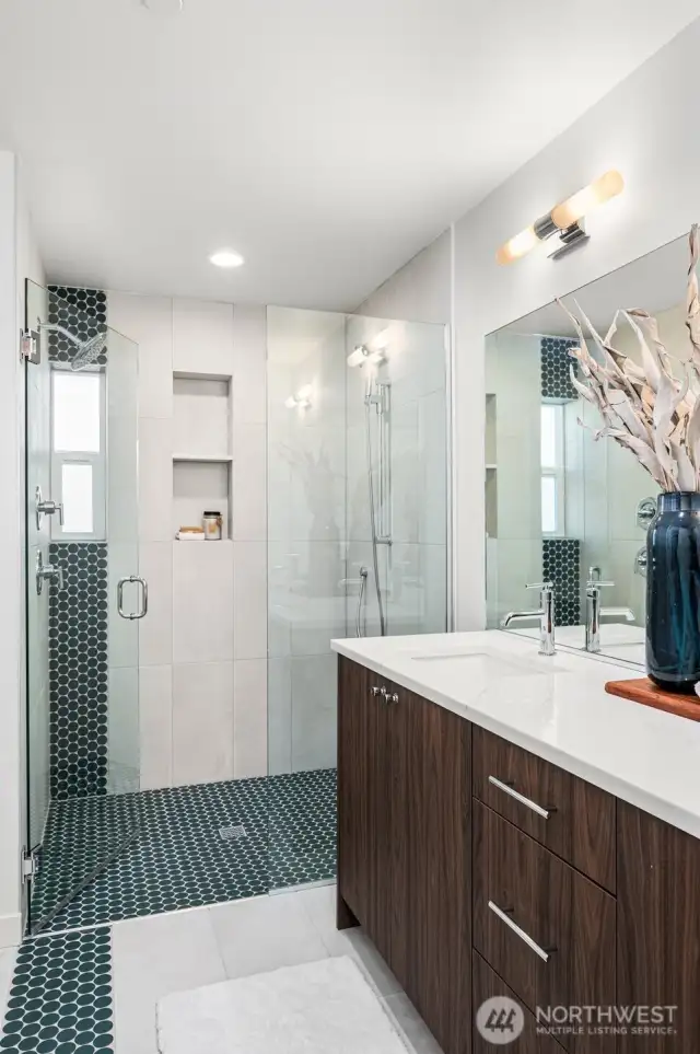 Another view of the luxurious primary bath—notice the elegant tilework and high-end finishes that elevate the space.