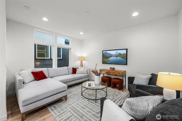 Step into the living room where entertaining feels effortless—natural light, open-concept flow, and a layout that makes sense.