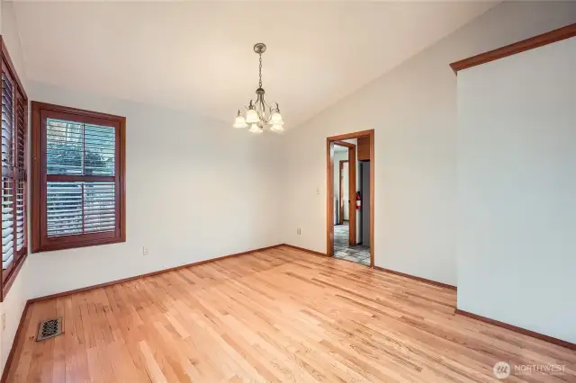 Vaulted ceilings in the formal dining room that opens to the living room.
