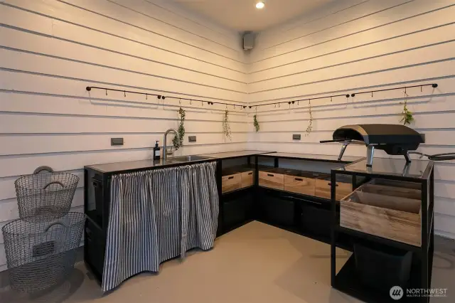 Outdoor kitchen cabinets will stay with the home.