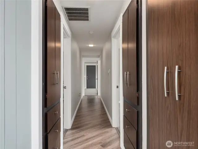 Hallway leading to three bedroom and two full bathrooms.