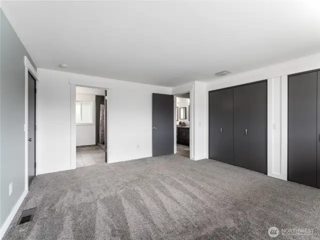 Primary suite bedroom with access to outside.