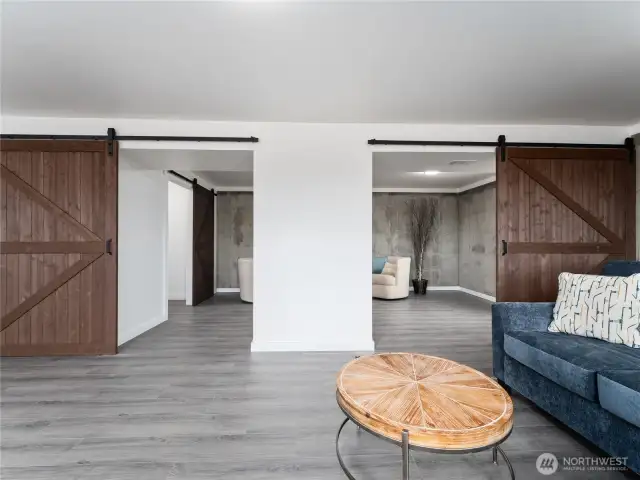 New barn doors create a stylish division for a private living space.