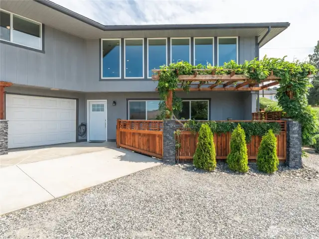 Lower-level garage with backyard access, private outdoor spa area, and footings in place for a future deck expansion.