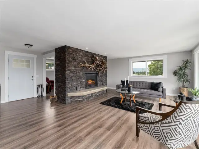 Upper-level front entry opens to a beautifully updated, light-filled living space.