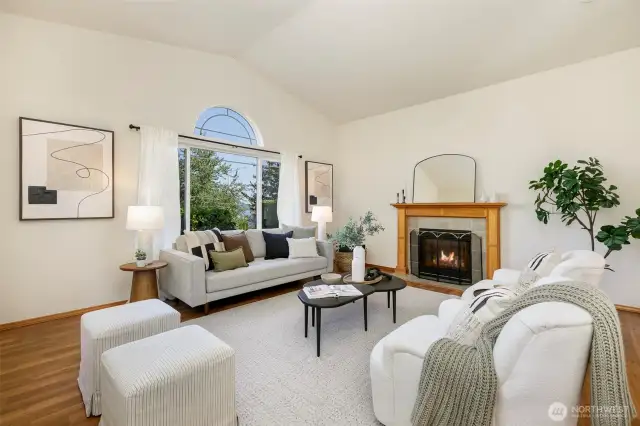 Living room with gas fireplace and vaulted ceilings