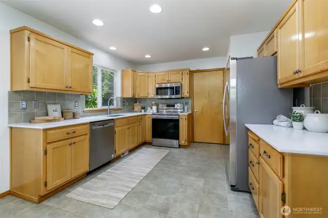 Kitchen with quartz counters and stainless appliances
