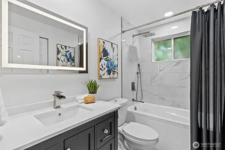 Updated Hall bathroom with soaking tub.