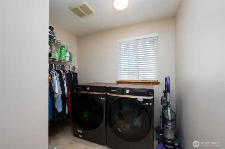 Nice sized laundry room provides additional storage