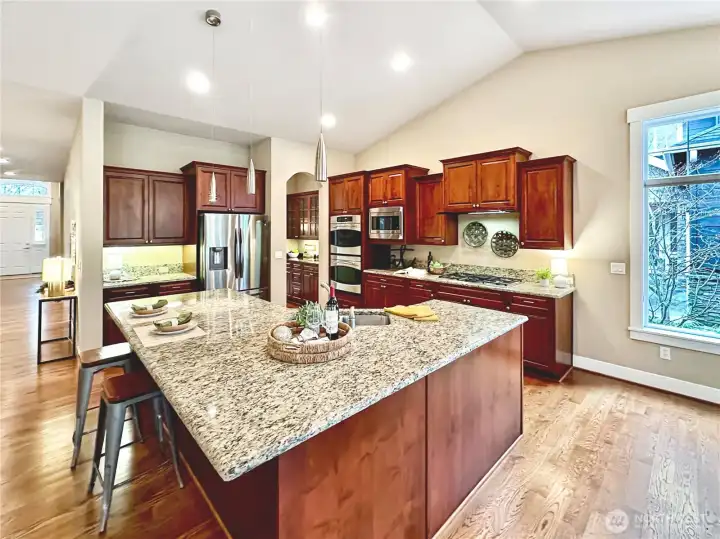Beautiful kitchen offers rich cabinetry and granite counters, stainless appliances & great pantry space.