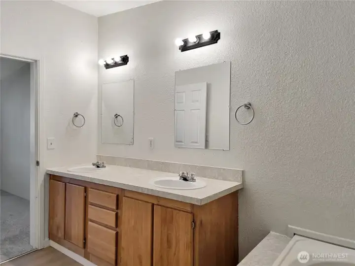 Spacious dual sink vanity offering extra counter space and storage—perfect for busy mornings.