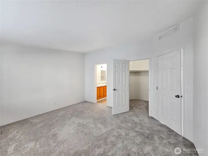 Roomy walk-in closet with abundant hanging space and room for organization—designed to keep everything neatly in place.