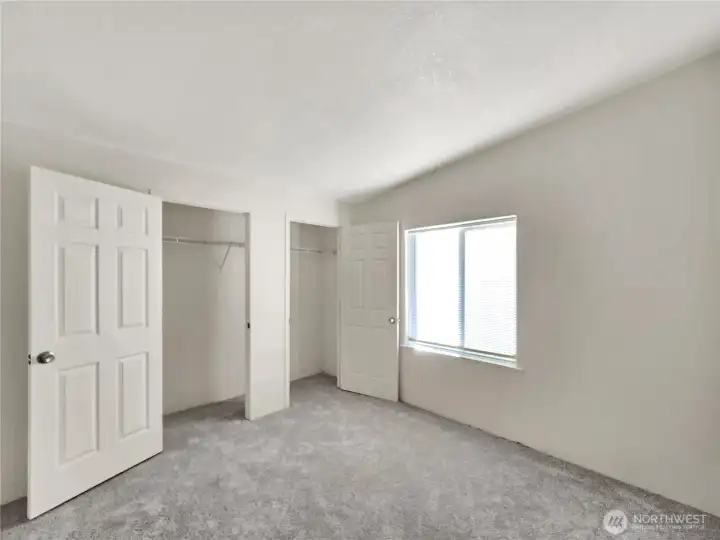 Comfortable secondary bedroom with great natural light and flexible space for guests, hobbies, or a home office.