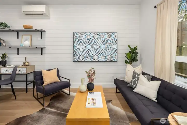 Open concept main floor with large windows and functional flow.