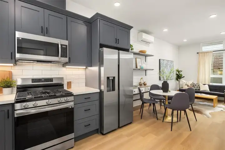 stainless appliances with a side by side fridge.