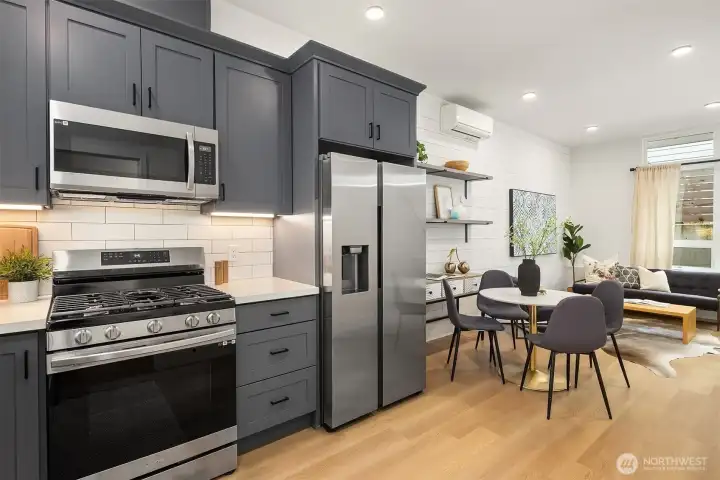 Gas range and side by side fridge. Kitchen opens to main living for easy entertainment. Bathrooms conveniently located on all floors as well.