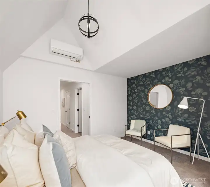 Spacious and dreamy primary suite offers vaulted ceilings, stylish accents, a walk-in closet and luxurious primary bath.