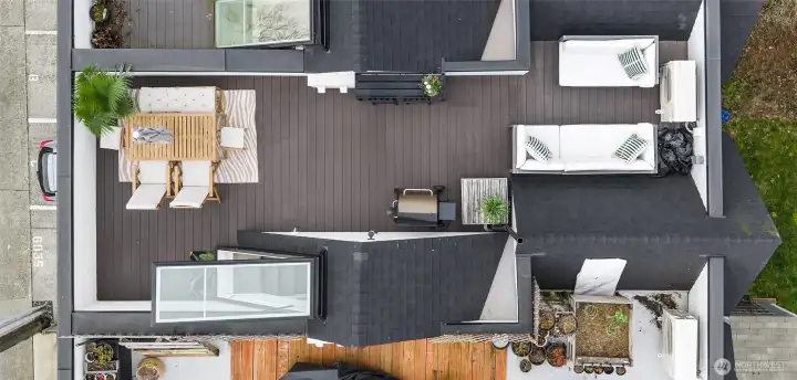 Rooftop lounge offers true indoor/outdoor living with a professionally installed $7K decking surface upgrade.