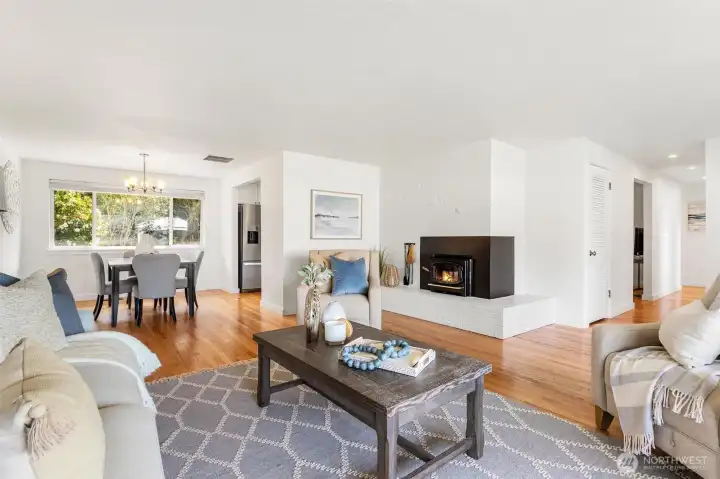 Living room with wood buring fireplace.