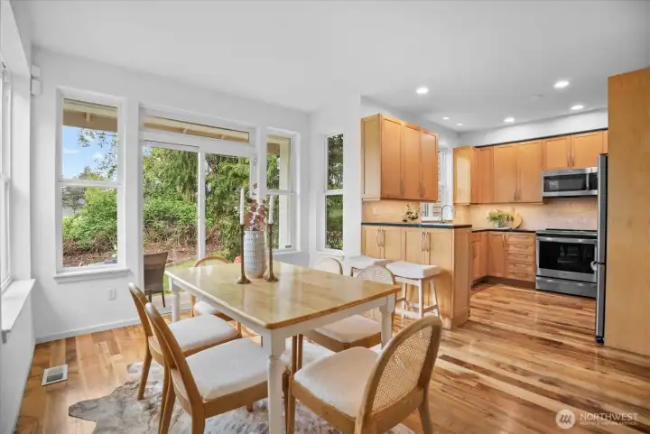 Kitchen and dining area with tons of natural light from the West and territorial views of the Sammamish river.