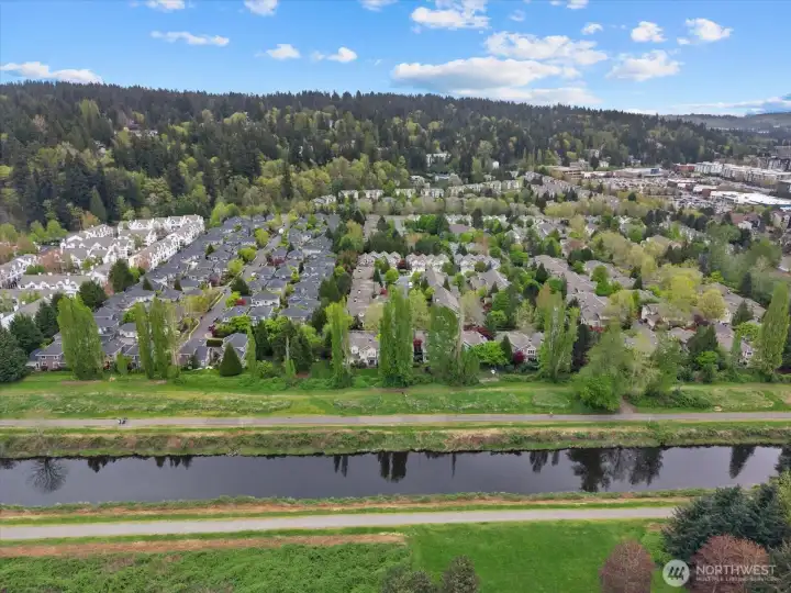 Premium lot adjacent to the trail with access just a few doors down to the right.  There is a buffer and wire fence between the trail and home for extra privacy.