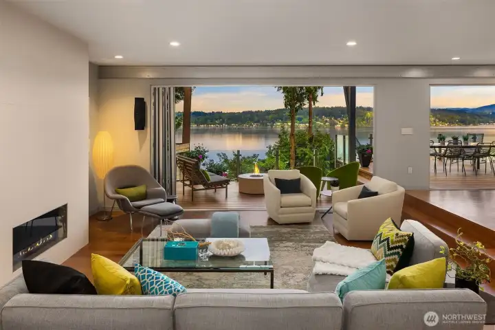 Generous living room with fireplace and captivating views.