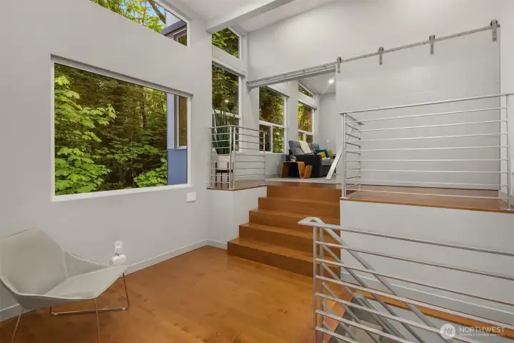 Upper landing leading to additional bedroom or bonus room with ample closet space.