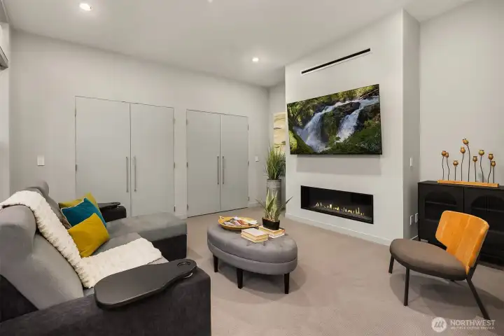 Multi-use space on upper level. Currently set-up as a lounge but can be a bedroom with ample custom closets.