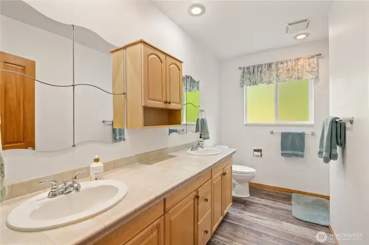 Full bath with double vanities