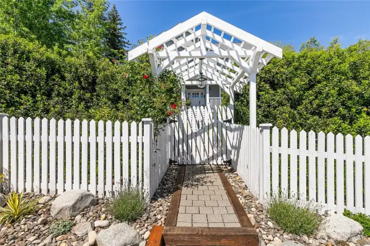 Rose arbor and entrance gate with pendant light
