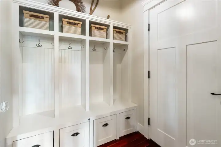 Mudroom entrance off of garage with cubby shelving and storage.