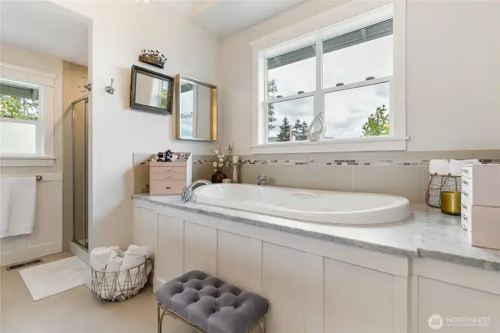double size soaking tub with marble deck.