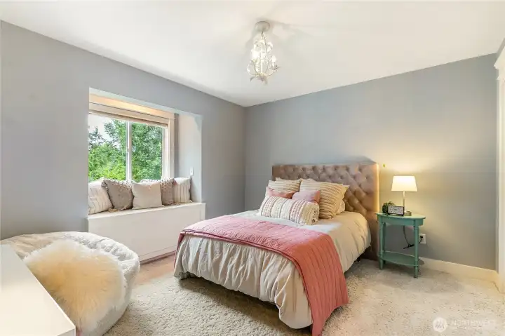 Bedroom 2 with window seat - garden and teritorial views