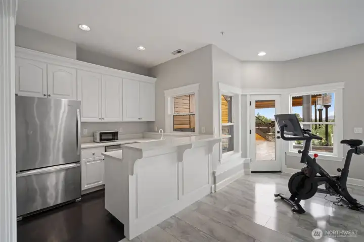 this bonus space has it's own kitchen for easy access to the exterior. this bonus space has it's own kitchen for easy access to the exterior.