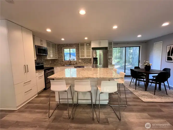 Large open concept great room with granite island Large open concept great room with granite island