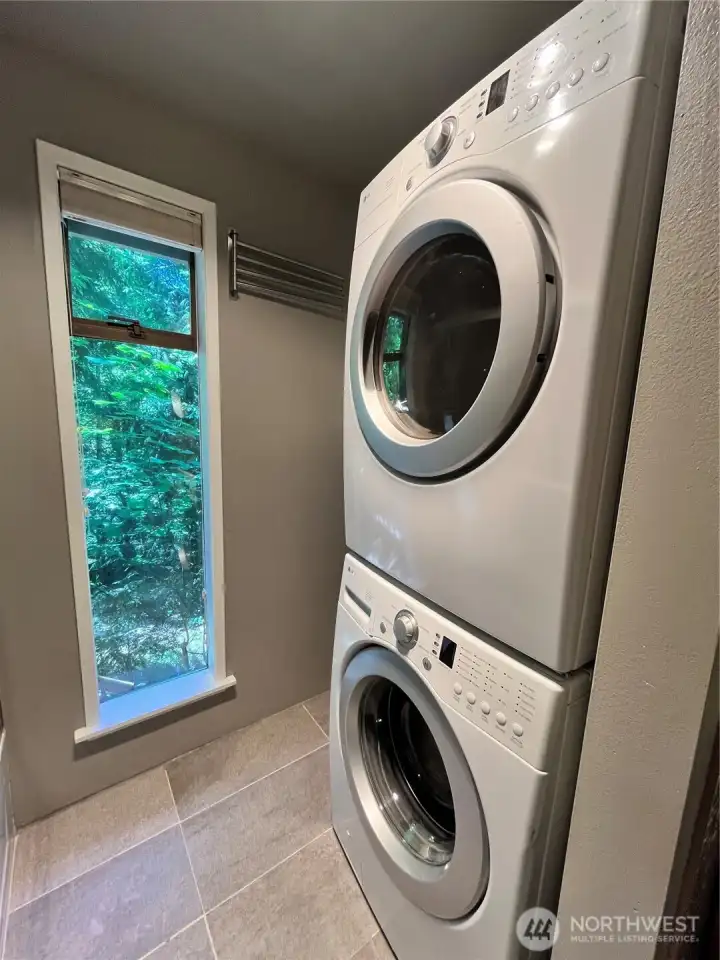 Utility area with modern washer / dryer set Utility area with modern washer / dryer set