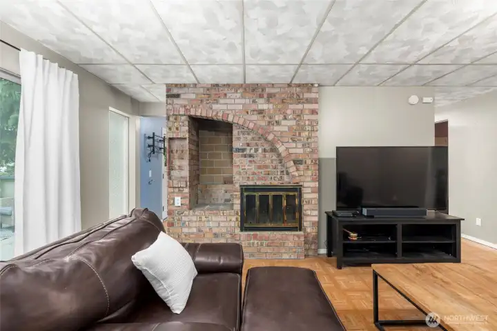 Red brick fireplace with storage section