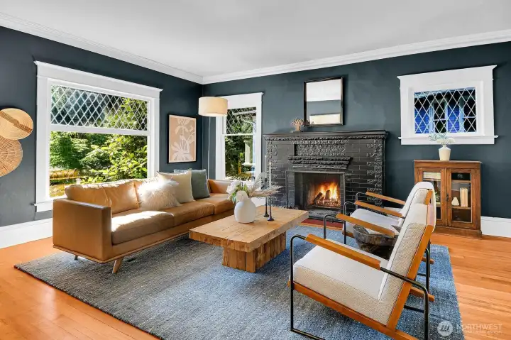 Huge, original leaded glass windows bring in light throughout this home. Huge, original leaded glass windows bring in light throughout this home.