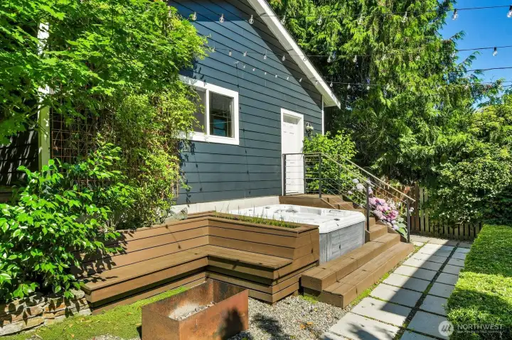 A wood-burning firepit with built-in benches adds the finishing touch to this retreat. A wood-burning firepit with built-in benches adds the finishing touch to this retreat.